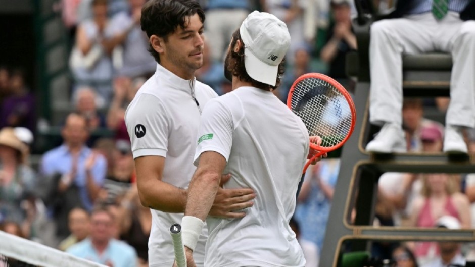 Australia's Jordan Thompson (right) was forced to retire from his Wimbledon fourth-round match against Taylor Fritz with an injury