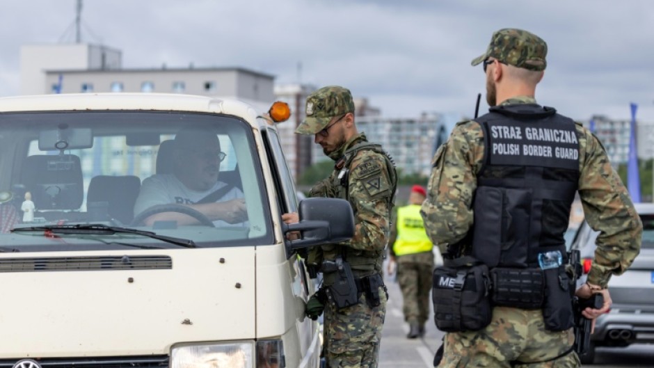 Polish border guards check drivers at the Polish-German border in Slubice, western Poland