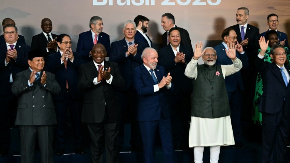 Heads of state and government of member, partner, and external engagement countries applaud during the family photo at the BRICS summit in Rio de Janeiro, Brazil, on July 7, 2025