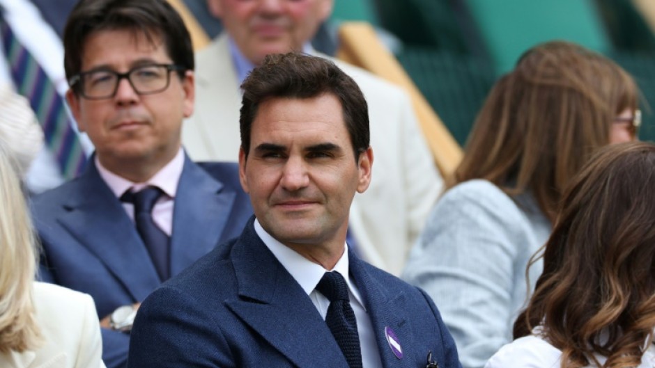 Roger Federer watching Novak Djokovic win from the royal box of Wimbledon's Centre Court