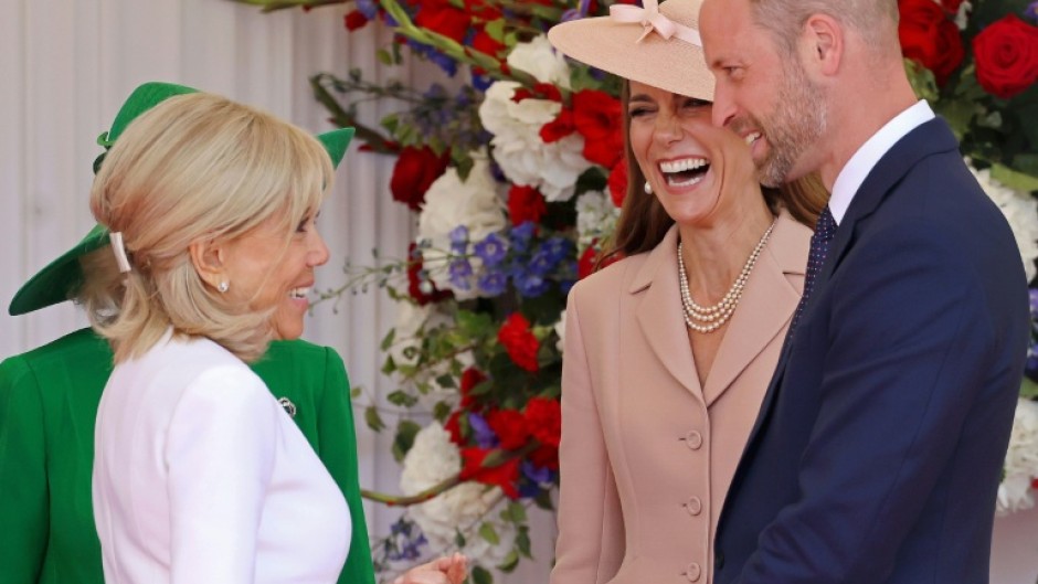 Dressed in a pale pink Dior jacket and dress ensemble, Catherine, Princess of Wales and her husband Prince William greeted the Macrons at an airbase west of London