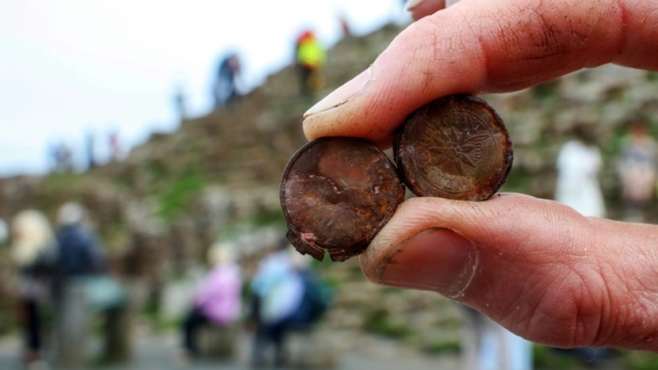 Visitors have been leaving coins in cracks at the Giant's Causeway in Northern Ireland