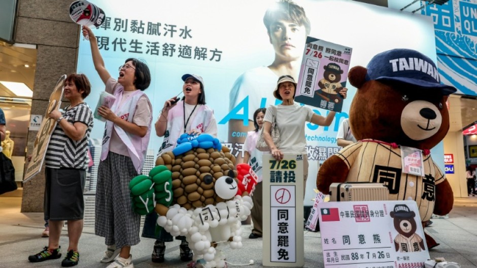 Supporters of a Taiwan recall vote shout 'Great recall, great success' in Taipei on July 22, 2025, ahead of recall elections this month
