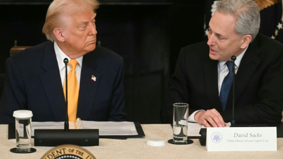 US President Donald Trump listen to White House AI and Crypto Czar David Sacks speak during a White House crypto summit in March