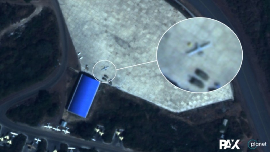 This handout satellite image taken on December 9, 2021 by Planet Labs PBC shows what Dutch peace organisation PAX says is a Turkish Bayrakter TB-2 drone parked outside a hangar at the northern part of Hara Meda air base in Bishoftu, Ethiopia