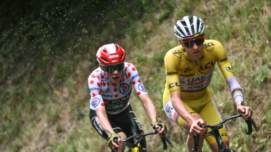 Tadej Pogacar wearing the overall leader's yellow jersey and Danish rider Jonas Vingegaard arrive in Paris Sunday