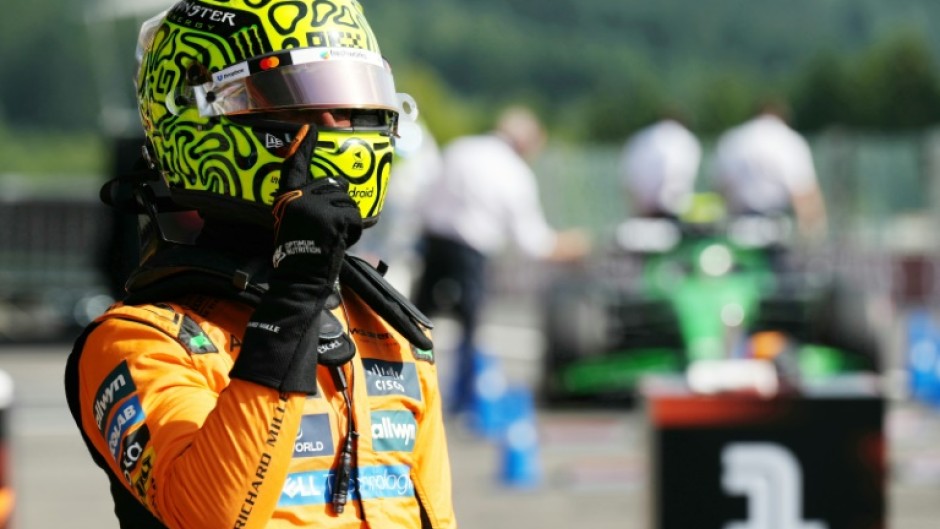 McLaren's British driver Lando Norris celebrates his pole position after the qualifying session ahead of the Formula One Belgian Grand Prix