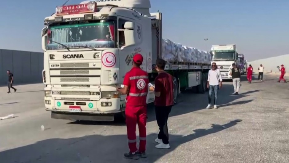 Aid trucks have begun crossing into Gaza from Egypt, but aid agencies warn that without a ceasefire, large-scale operations will be impossible