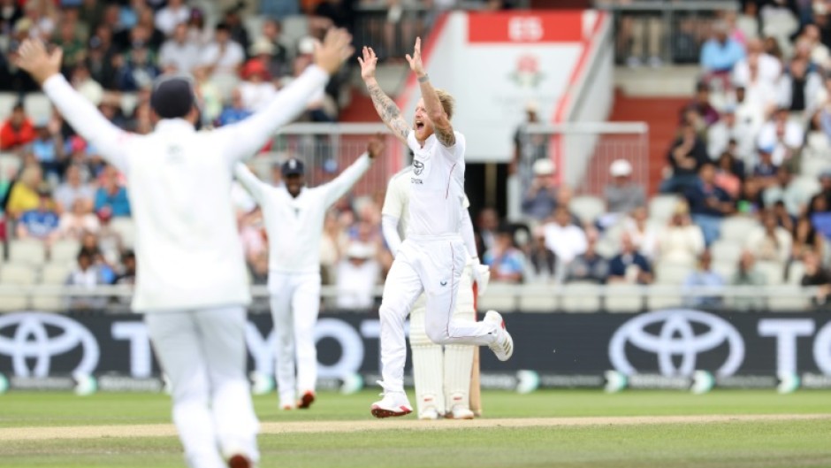 England captain Ben Stokes (C) celebrates with team-mates after dismissing India's KL Rahul in the fourth Test at Old Trafford