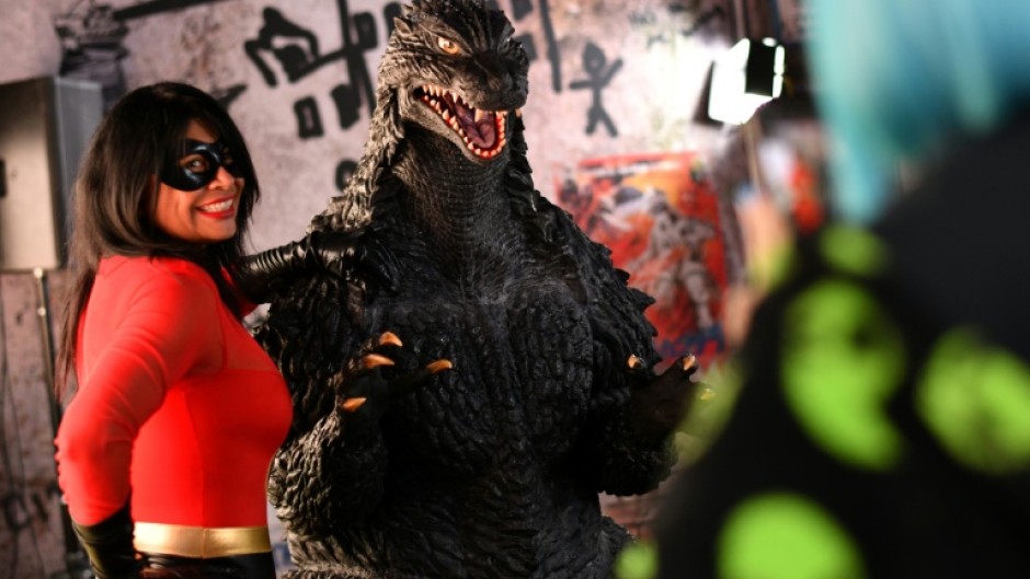 A "Godzilla" fan poses at Comic-Con in San Diego, California on July 26, 2025