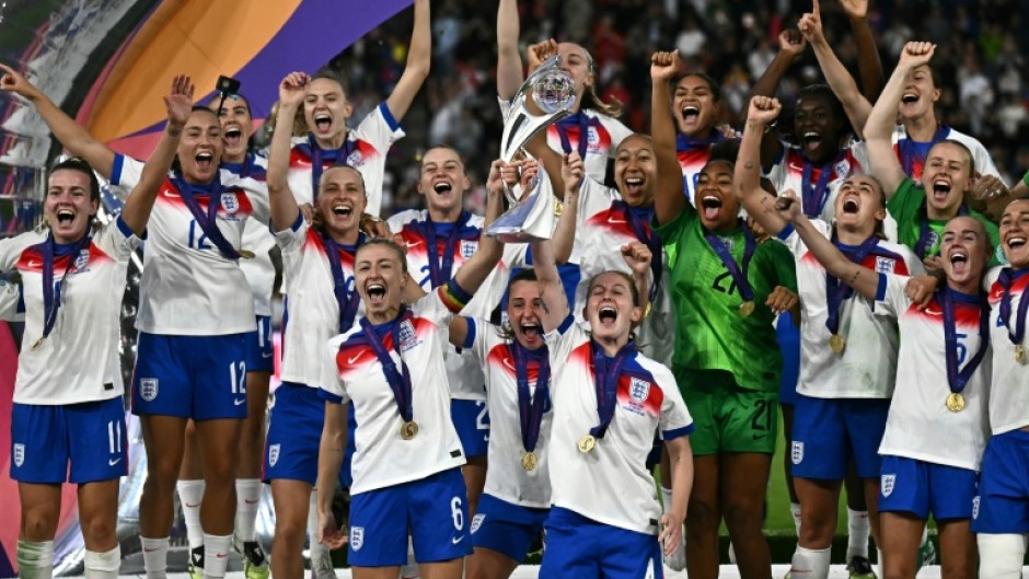 England players lift the trophy after beating Spain on penalties to win the Women's Euro 2025