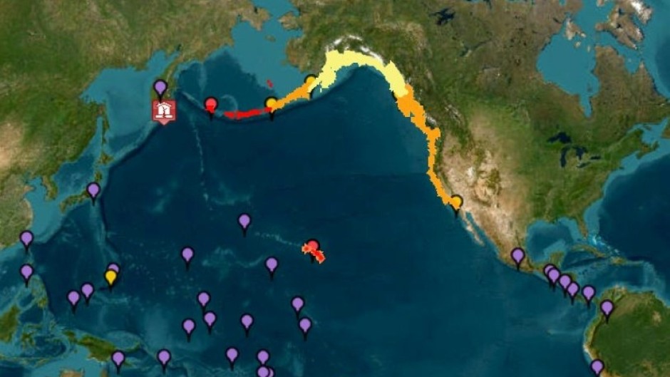 This image courtesy of the National Oceanic and Atmospheric Administration's Tsunami Warning System shows tsunami warnings (red), advisories (orange) watches (yellow) and threats (purple) after an 8.7 earthquake hit off of Russia's far east