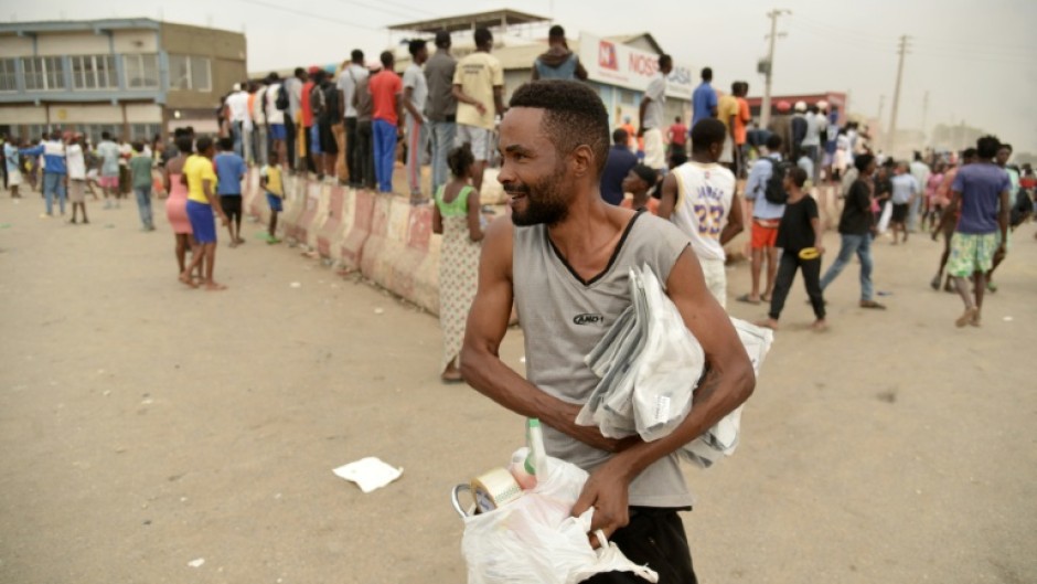 Looting erupted in Luanda on Monday, the first day of a strike against the rising prices of fuel