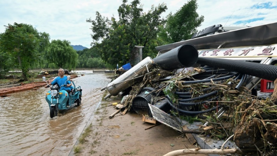 Swathes of northern China endured deadly rains and floods since last week that forced the evacuation of tens of thousands