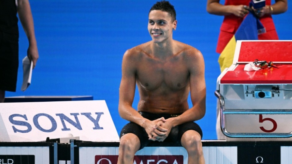Romania's David Popovici completed a 100m-200m sprint double at swimming's world championships in Singapore