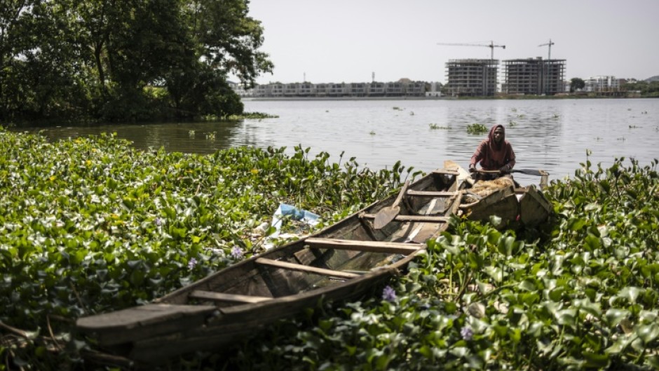 Sat in his pirogue on Jabi lake in Abuja this local fisherman, like his peers, has a mixed relationship with the city