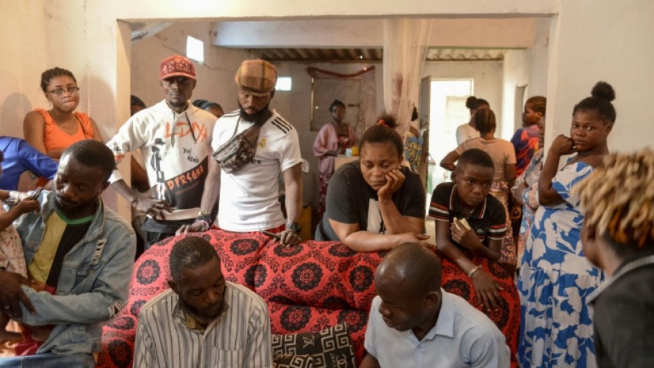 Relatives and friends of Silvia Mubiala mourn after she was allegedly shot by security forces during the unrest in the Angolan capital Luanda