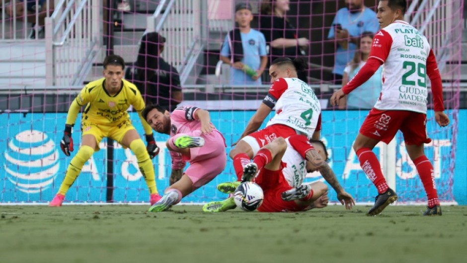 Argentine star Lionel Messi of Inter Miami tumbles to the pitch moments before he is removed with an injury during a Leagues Cup match against visiting Necaxa