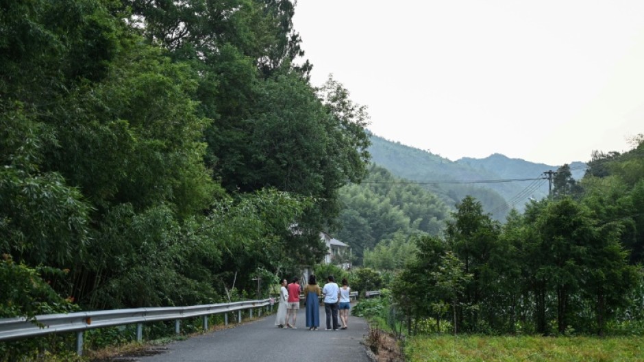 Female guests at 'Her Space' take a stroll in eastern China's Zhejiang province