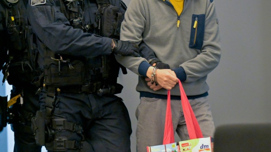Defendant Jian G., a former assistant to then-member of the European Parliament Maximilian Krah of the far-right Alternative for Germany party, arrives at his espionage trial in a court in Dresden, eastern Germany