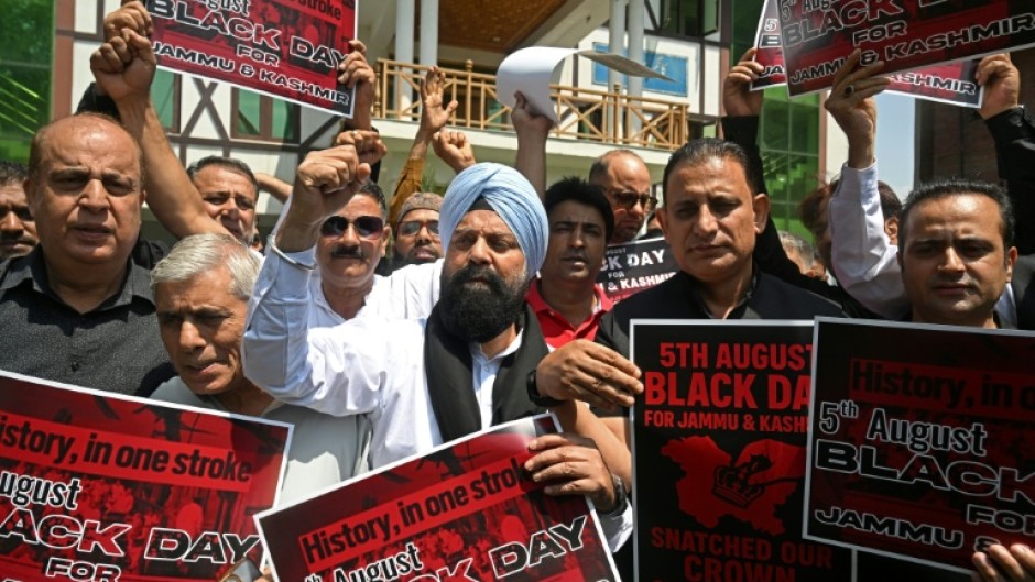 Protesters in Srinagar call for the restoration of state-hood for Kashmir, which has been under direct rule from New Delhi for six years