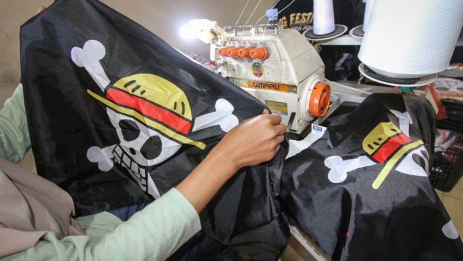 A factory owner says plain-clothes police raided his facility to stop production of the emblem