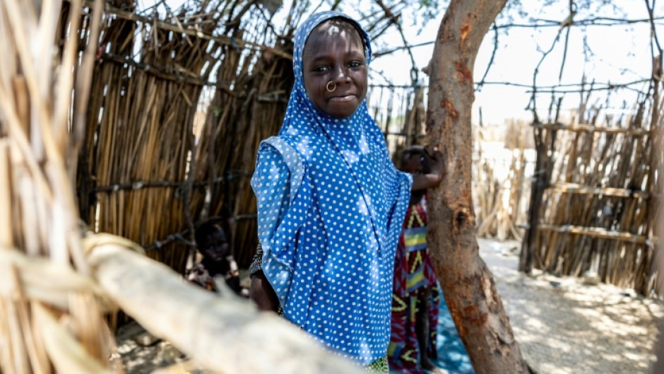 A young Chadian poses for a photograph at the Kiskra site for internally displaced people