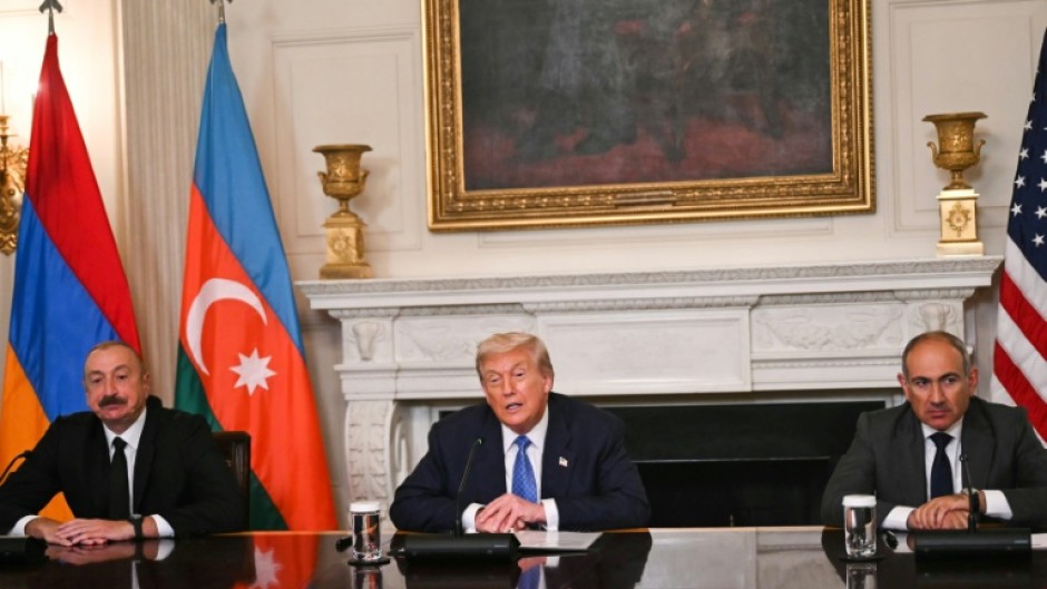 US President Donald Trump at the signing with Azerbaijani President Ilham Aliyev (L) and Armenian Prime Minister Nikol Pashinyan (R)