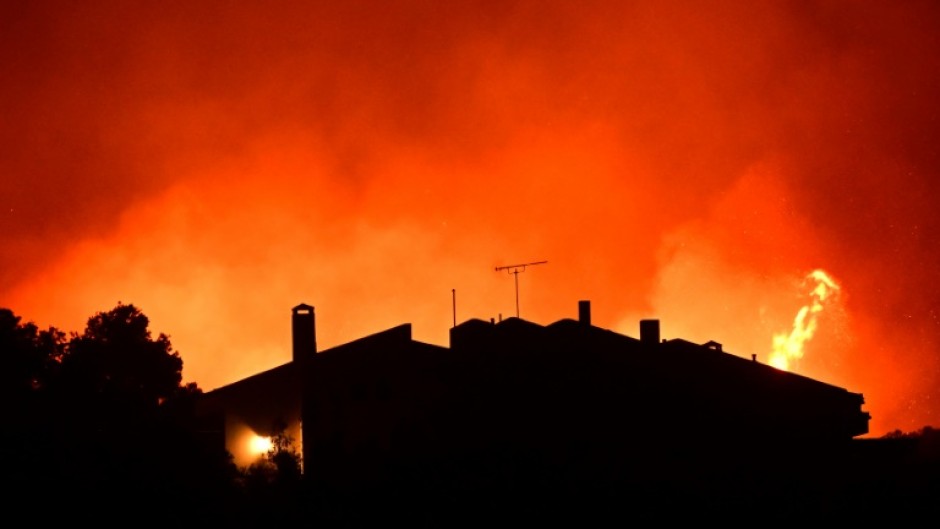 Over 200 firefighters had battled to keep the fire from threatening the coastal resorts dotting the coast of Attica