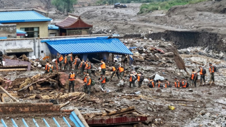The death toll from flash floods and mudslides in China's northwestern Gansu has risen to 13, with 30 people missing, state media said