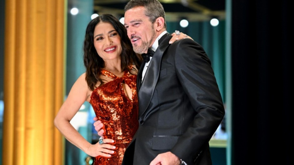 Antonio Banderas, pictured with Salma Hayek in 2023, is 65 but says he has no plans to stop working