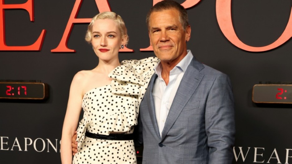 Julia Garner (L) and Josh Brolin attend the world premiere of Warner Bros film 'Weapons' in Los Angeles