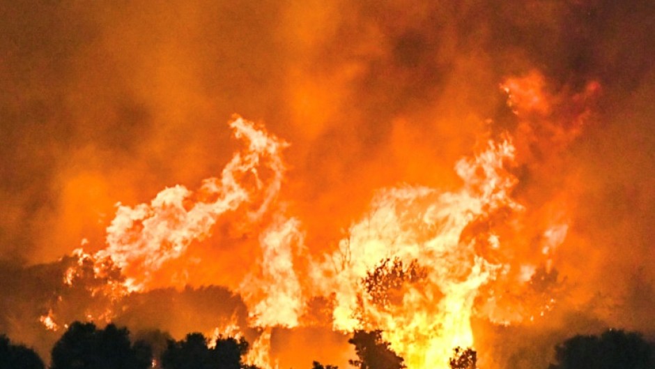 A wildfire burning a forest near the Greek city of Patras