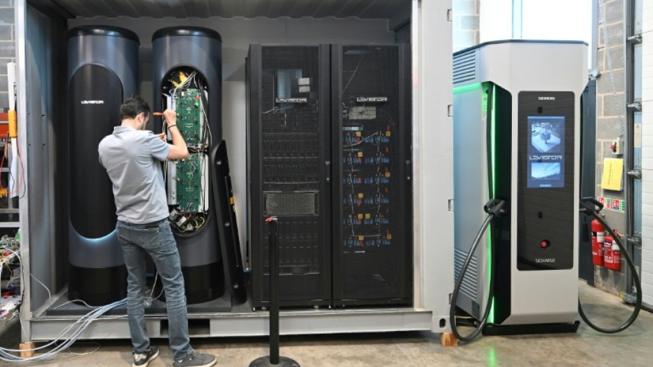 An engineer works on a flywheel energy storage system at Levistor's workshop in southwest London