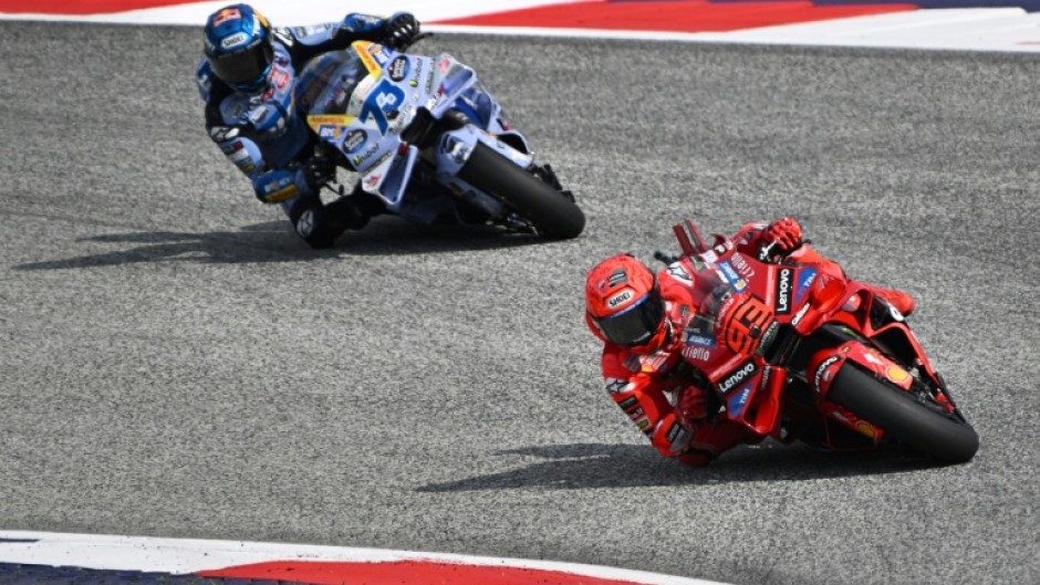 Marc Marquez (R) leads his brother Alex Marquez on his way to victory in the sprint at the Austrian MotoGP