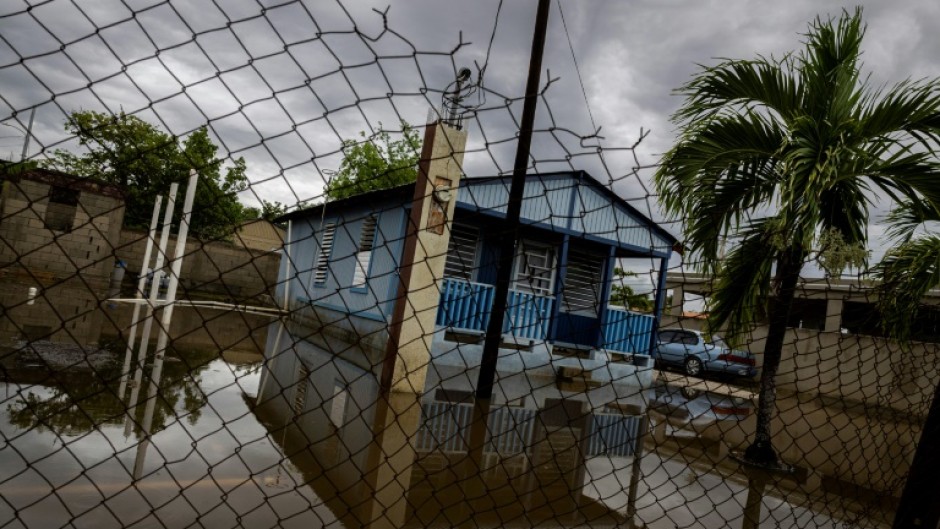 A house is seen partially flooded after Hurricane Erin battered the region in Guayama, Puerto Rico