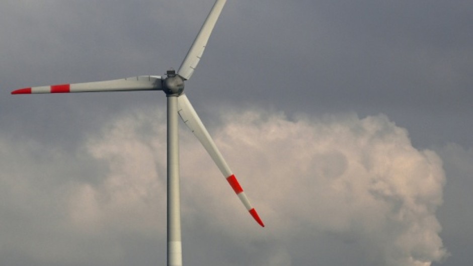 A wind turbine and a lignite-fired power plant near Neurath, western Germany