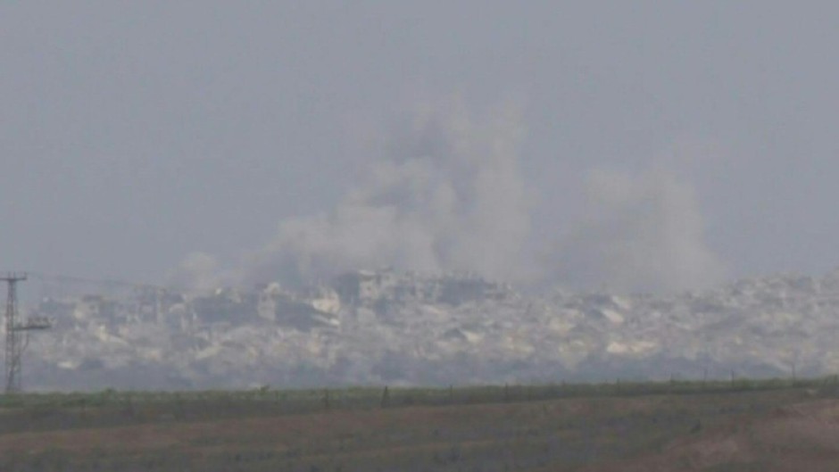 Israeli troops on Gaza border and smoke billows as Gaza City assault begins