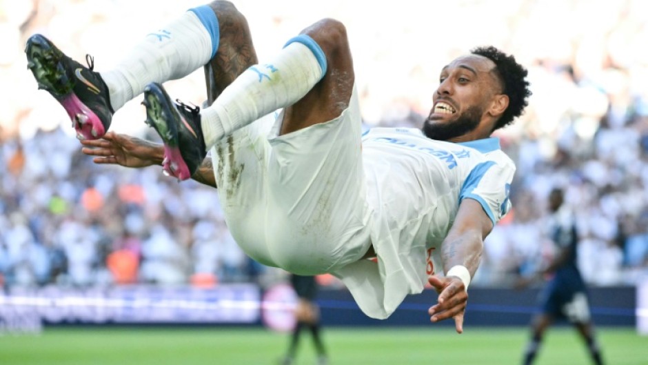 Pierre-Emerick Aubameyang celebrates after scoring one of his two goals in Marseille's 5-2 win over Paris FC on Saturday