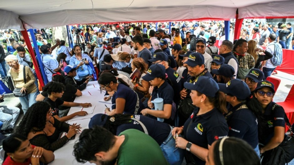 Thousands line up to join the civilian militia in Venezuela after President Nicolas Maduro warned of possible US invasion