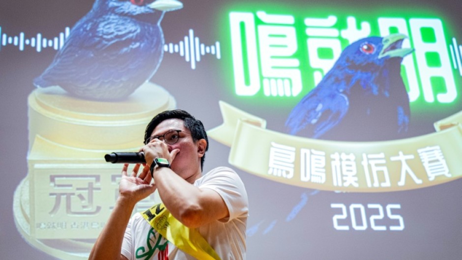 Bob Chan, who took top prize, imitates bird calls for the judges on Saturday