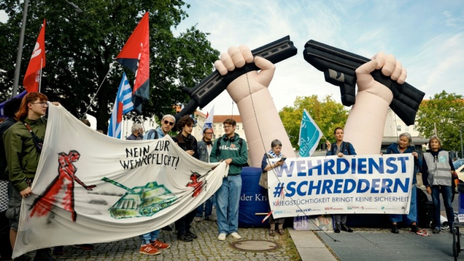 Activists protest against the idea of bringing back compulsory military service, in front of the Defence Ministry in Berlin