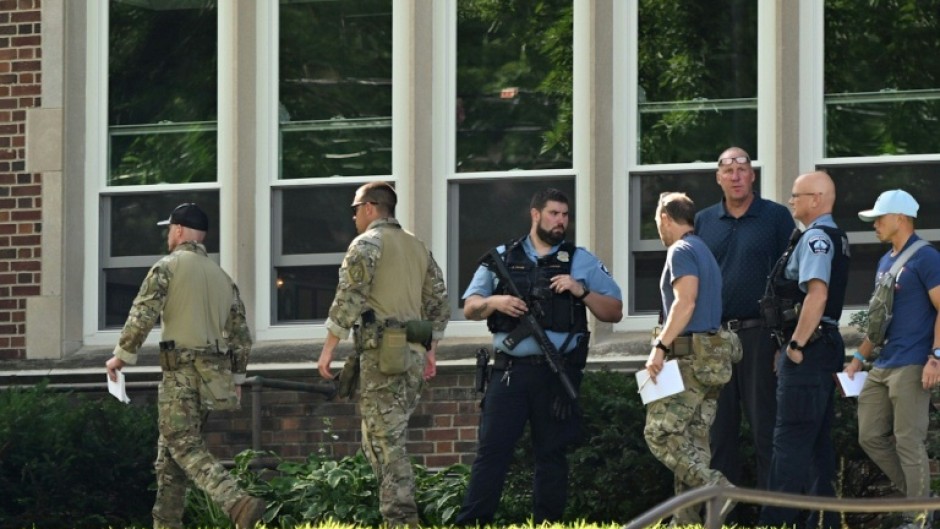 Law enforcement officers at the scene of the shooting at Annunciation Catholic School in Minneapolis, Minneosta