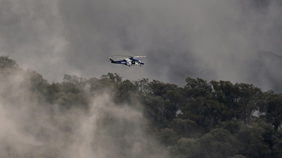 Australian police helicopters searched for a gunman suspected of killing two officers