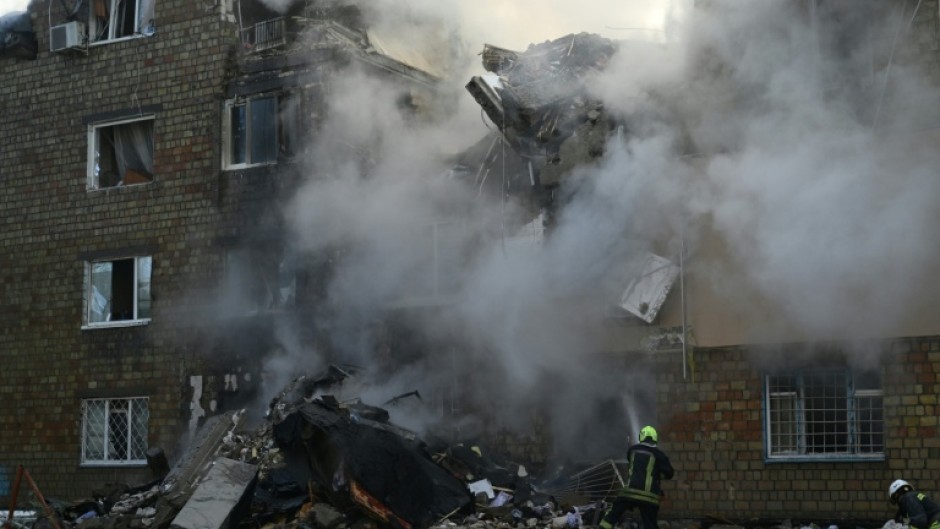 The attack -- one of the deadliest on Kyiv -- blasted a five-storey crater in one apartment block, ripping the building in two