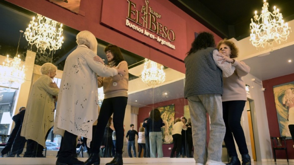 Women with Parkinson's disease dance in a tango therapy session in Buenos Aires