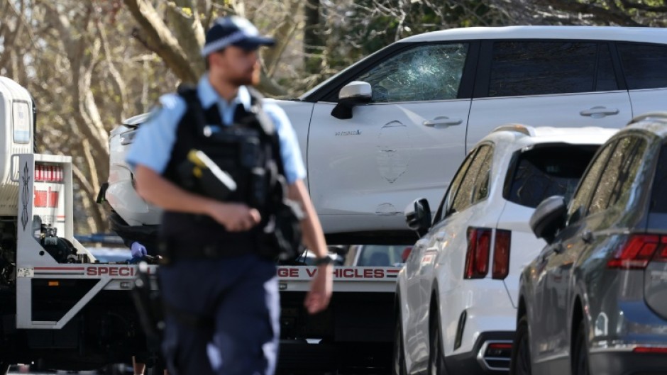 A tow truck removes a car after it was driven into the gates of the Russian consulate in Sydney on September 1, 2025