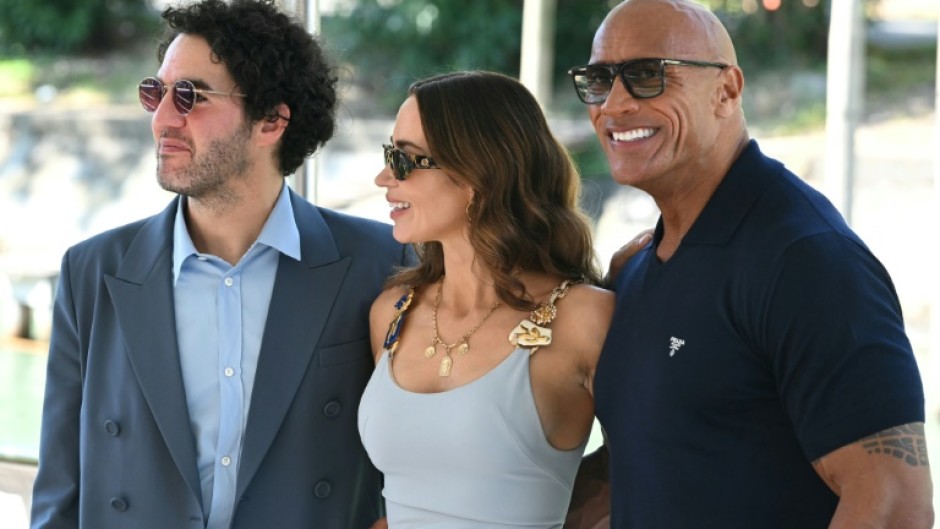 Dwayne Johnson with director Benny Safdie and co-star Emily Blunt