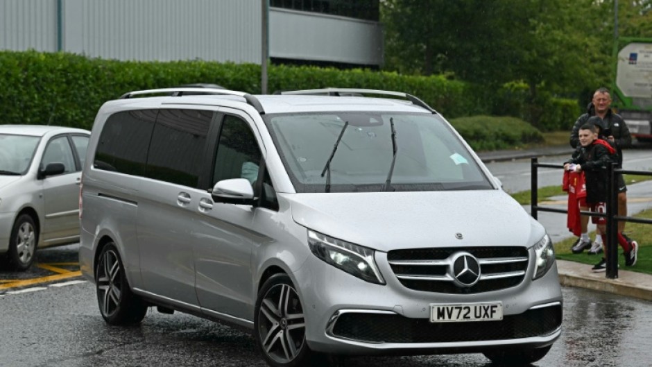 A vehicle believed to be carrying Sweden striker Alexander Isak arrives at Liverpool's training ground
