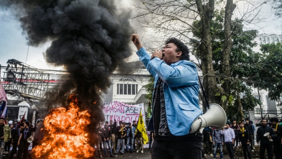 A demonstrator shouts slogans during a protest demanding police reform and the dissolution of the parliament in Bandung